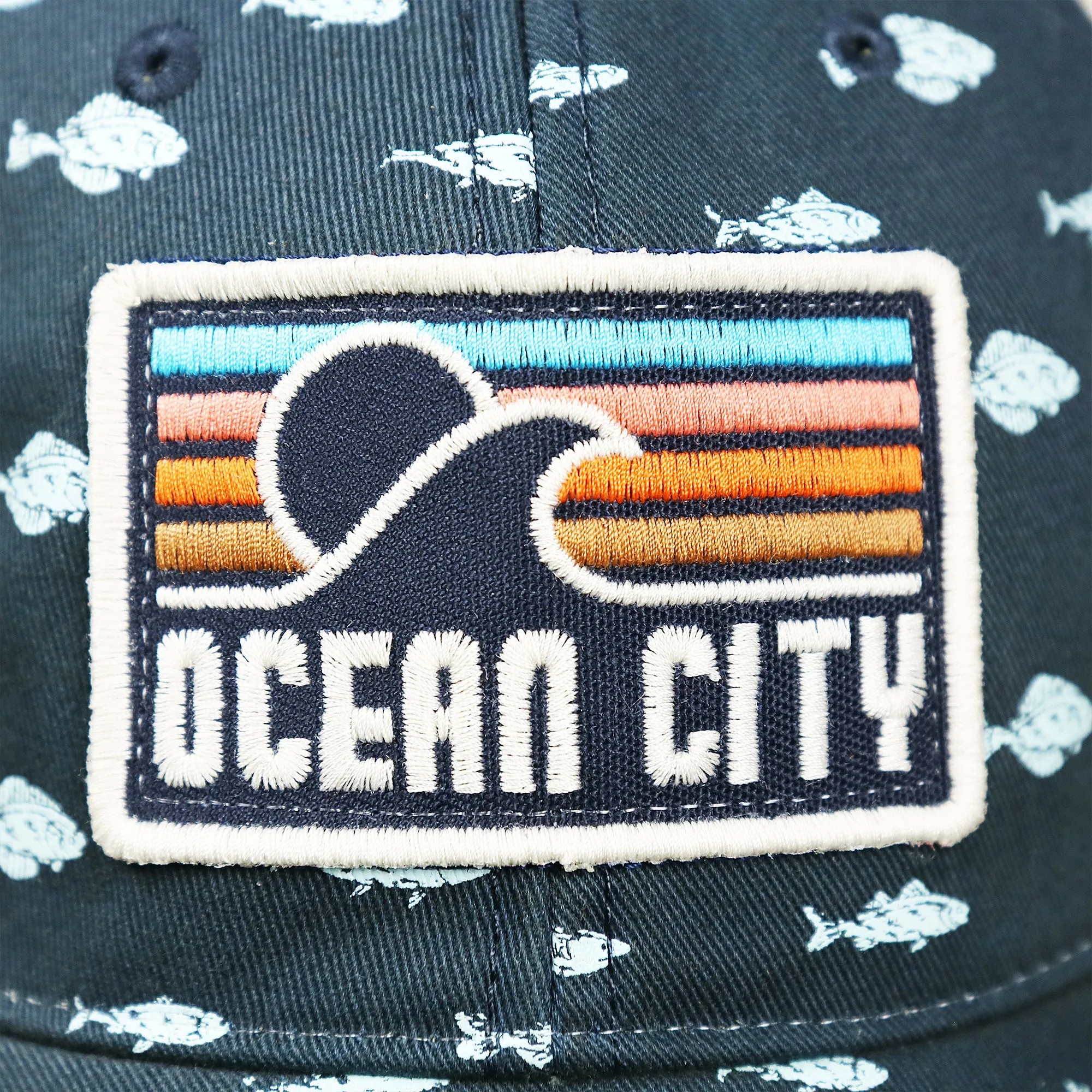 Ocean City Sunset Patch Fish Print Khaki Mesh Back Trucker Hat | Navy Blue Trucker Hat